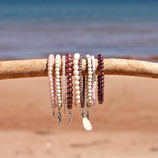 BRACELETS, SET of 9 - PINKS