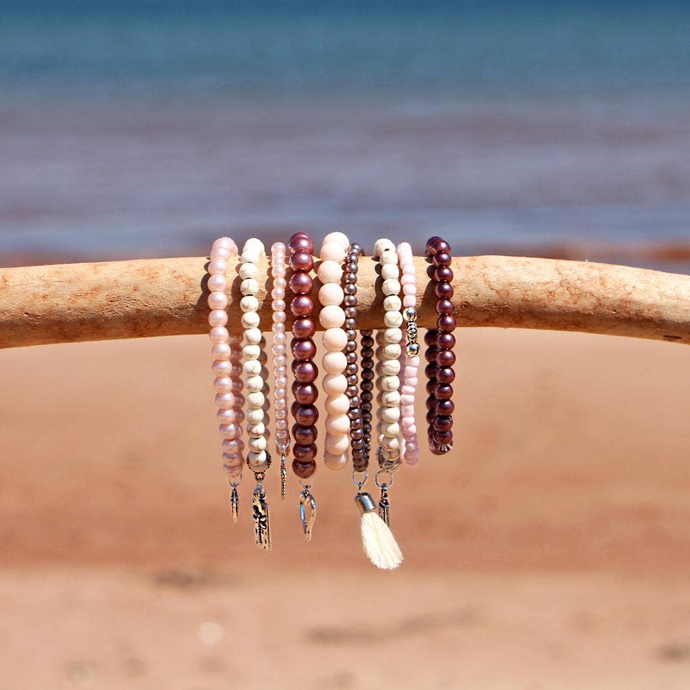 BRACELETS, SET of 9 - PINKS